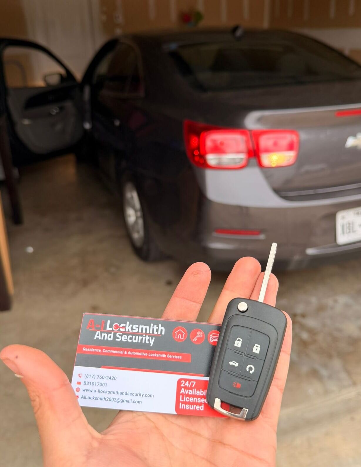A-I Locksmith And Security technician providing automotive locksmith service in Irving, including on-site car key replacement for a Chevrolet vehicle